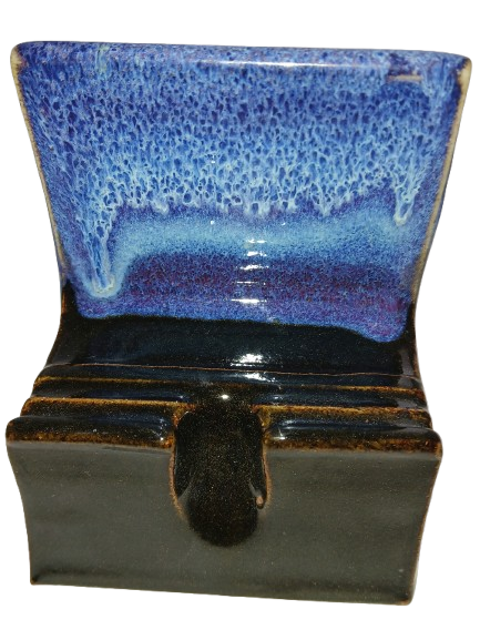 Handmade ceramic phone throne with cascading blue, violet, and black glaze
