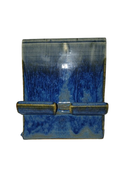 Handmade ceramic cell phone stand with white and deep blue flowing glaze