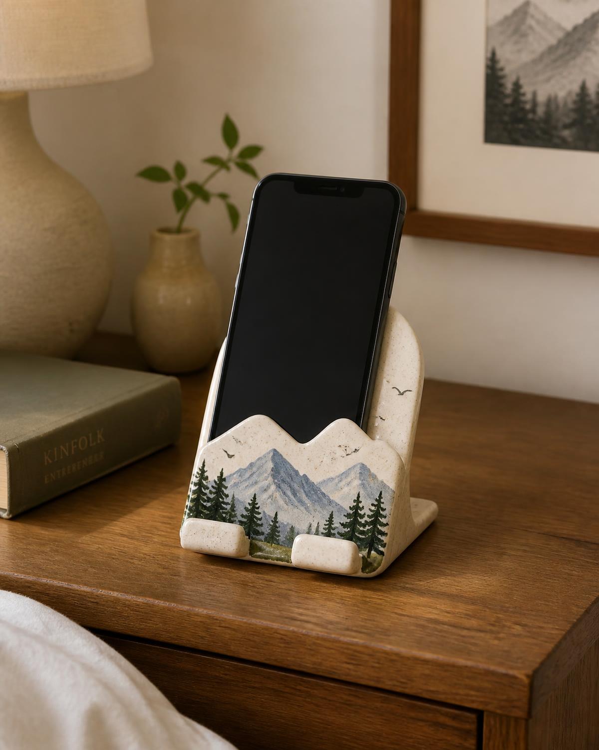Mountain-shaped handmade ceramic phone stand in a matte glaze